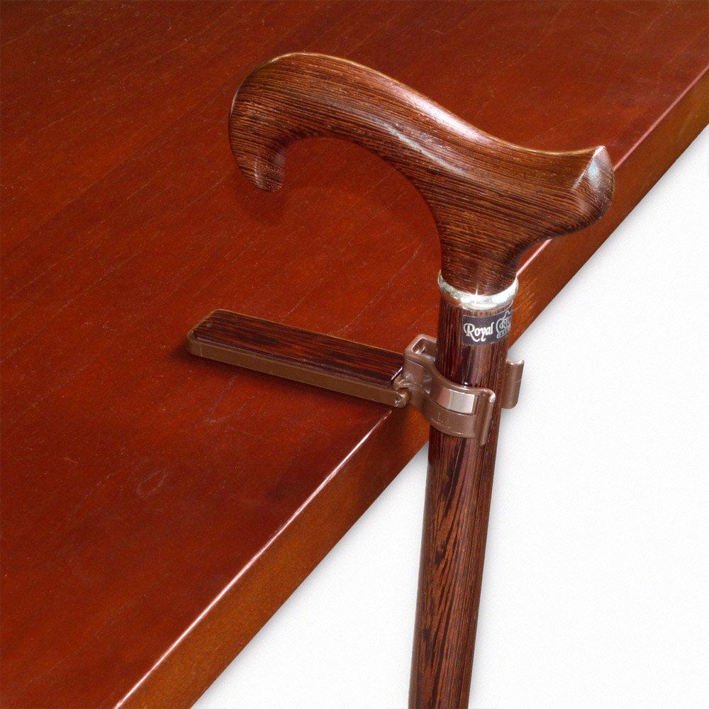 Does the wenge cane holder remain mounted on the cane as the user is walking?